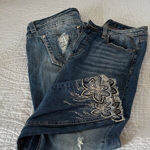 Two pairs of Miss Me jeans.